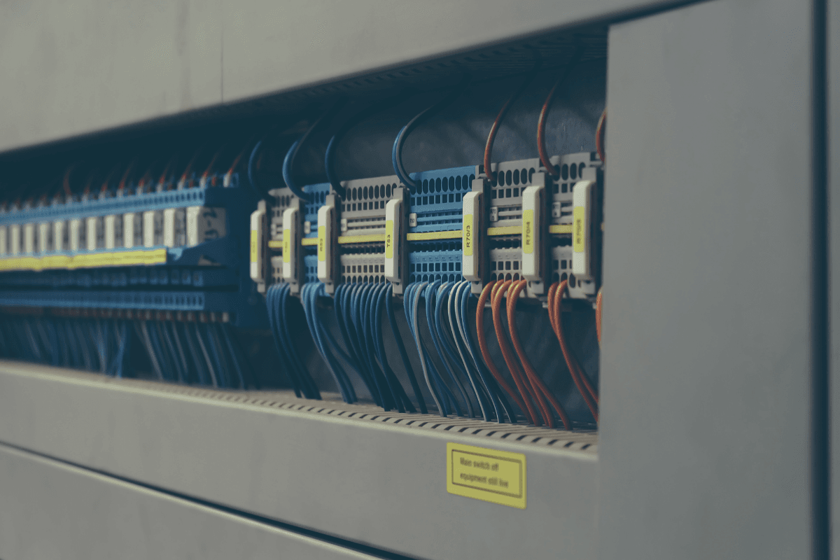 control panel with wired cable harnesses and terminal blocks for industrial automation and control systems