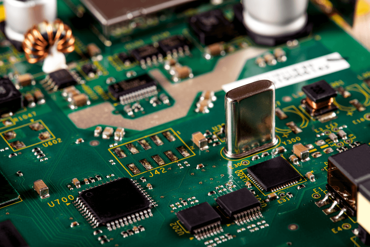 Printed circuit board showing both surface mount (SMT) and through hole (THT) electronic components used in PCB assembly.