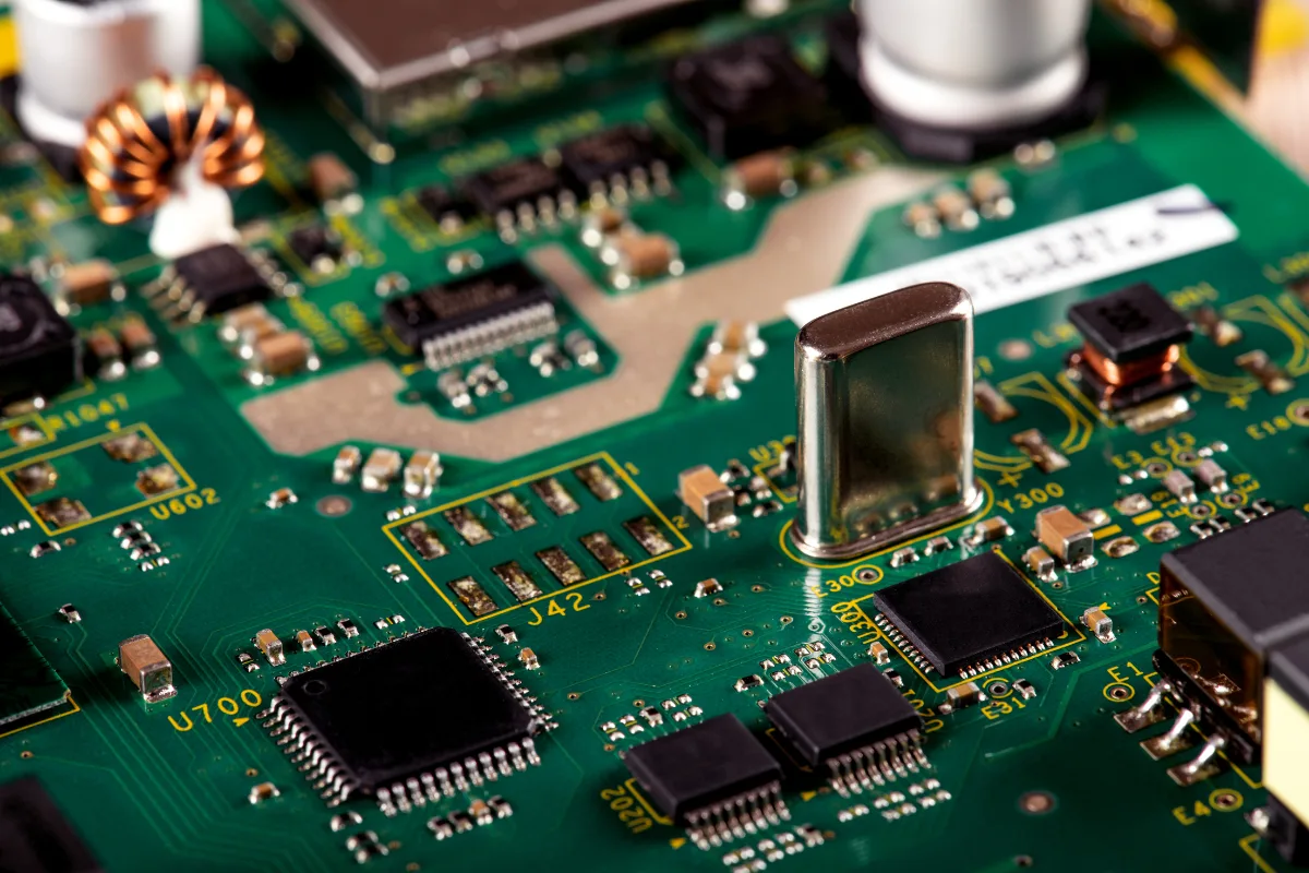 Printed circuit board showing both surface mount (SMT) and through hole (THT) electronic components used in PCB assembly.